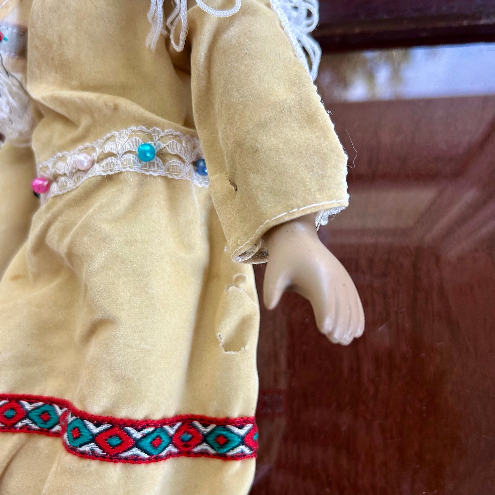 Vintage Porcelain Native American-Inspired Doll with Braids and Beaded Outfit