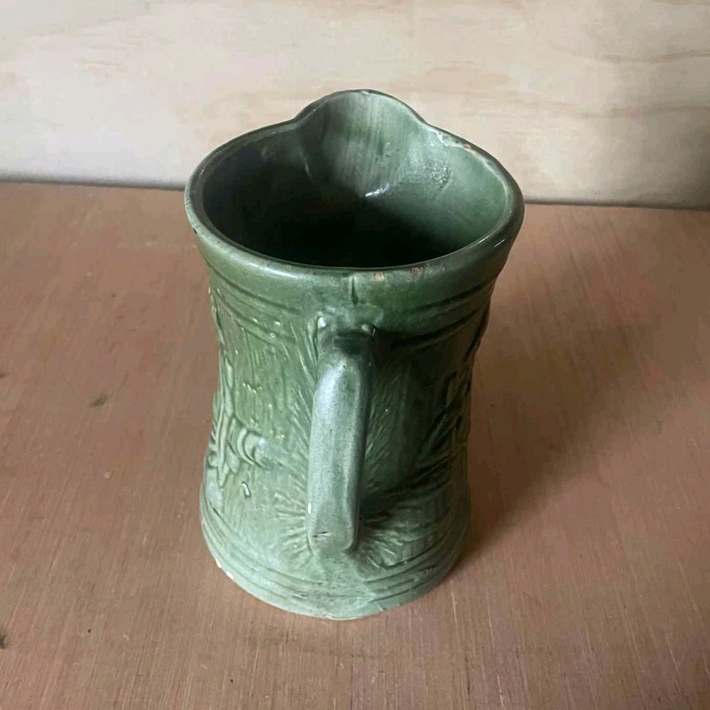 Green Ceramic Pitcher with Handle, Embossed Decorative Design, Glossy Round