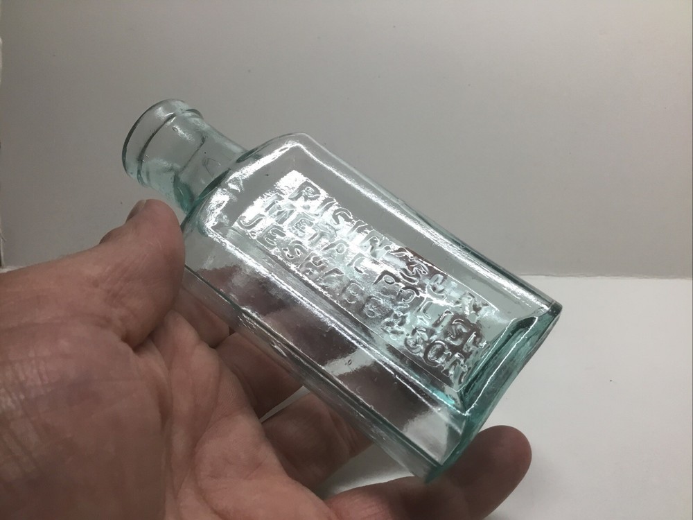 Small Antique Aqua Risin’ Sun Metal Polish Bottle. J. E. Sharp & Son.