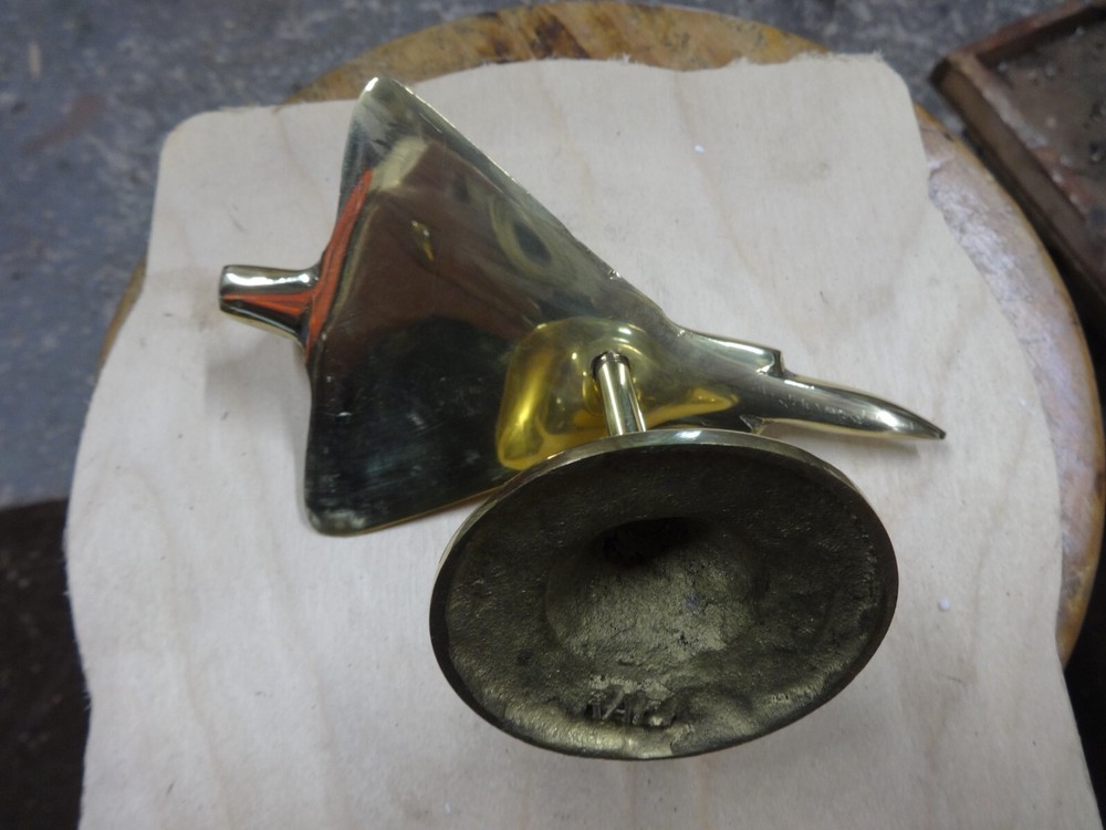 A Brass Mirage Jet Fighter.