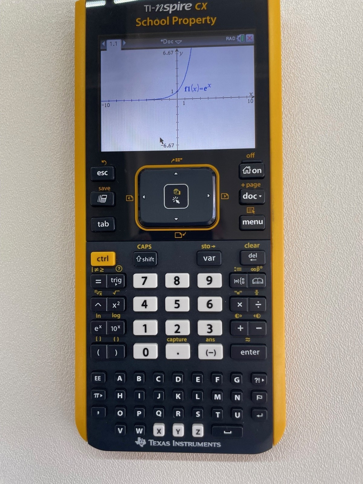 TI Nspire CX Color-Display Graphing Calculator with School Property Markings.