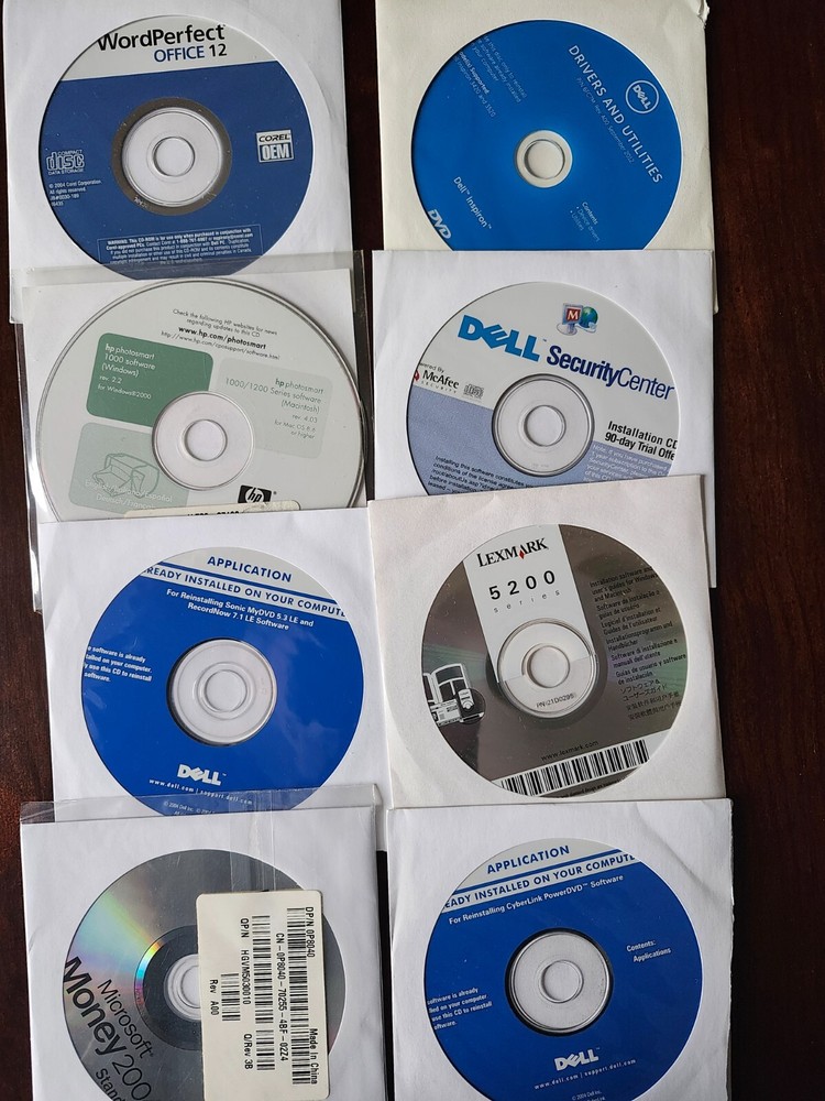 assorted computer installation and program discs