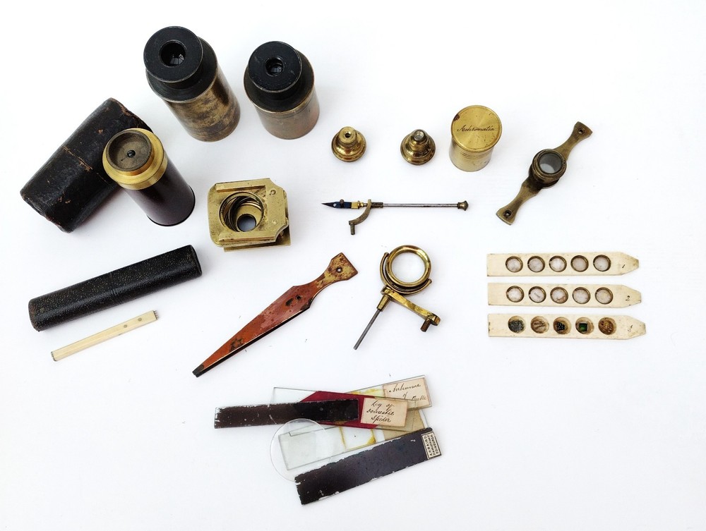 Brass microscope in case.