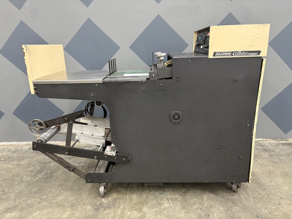 One (1) Short Baldwin Count-O-Veyor Model 110