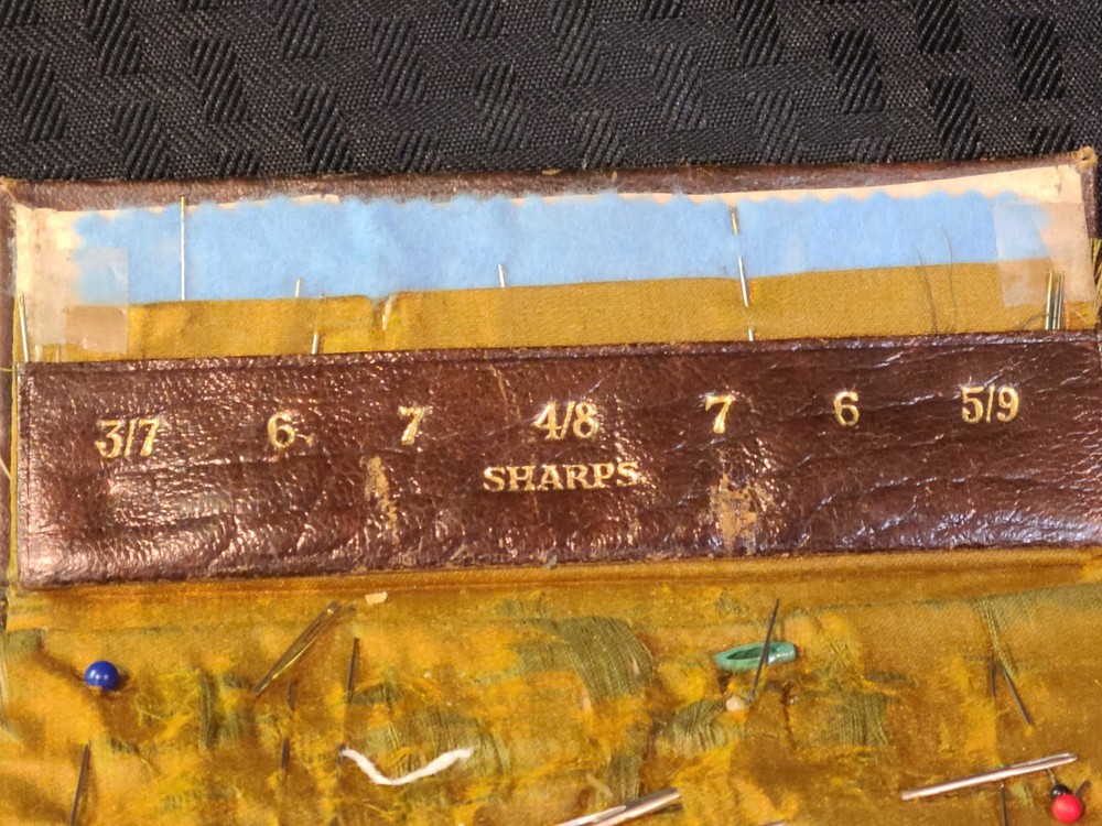 AntiqueLeather folding needle case made by Kirby, Beard & Co