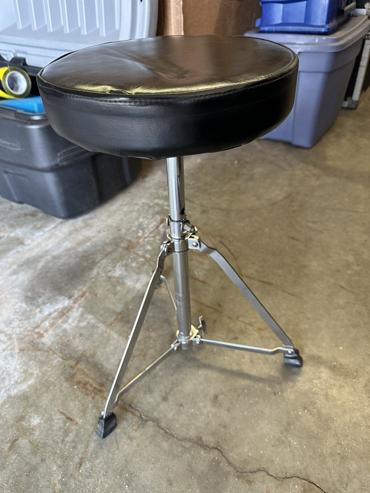 Drum throne.  Adjustable Folding Swivel Padded Seat Stool (small tear)