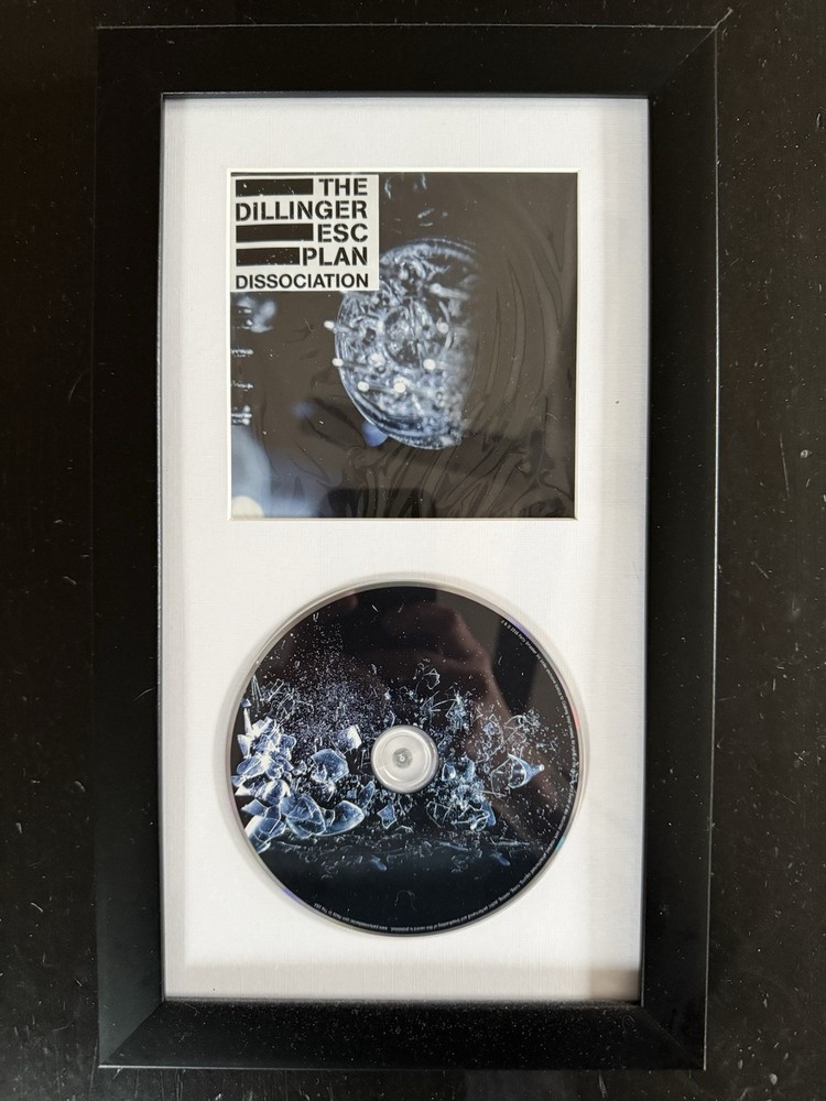THE DILLINGER ESCAPE PLAN - Framed ‘DISSOCIATION’ Booklet + CD (Unsigned)