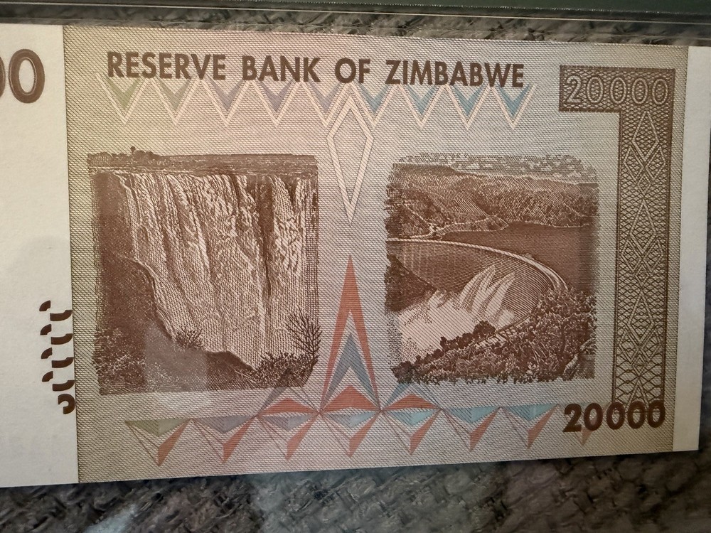 ✨ Zimbabwe 2008 20,000 Dollars — APMG Gem Uncirculated ✨