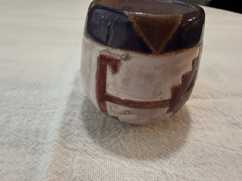 Handmade  clay pottery with a distinct glazed finish.