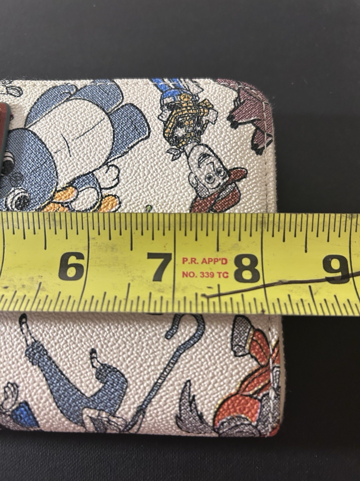 Disney dooney and bourke X Toy Story Wristlet