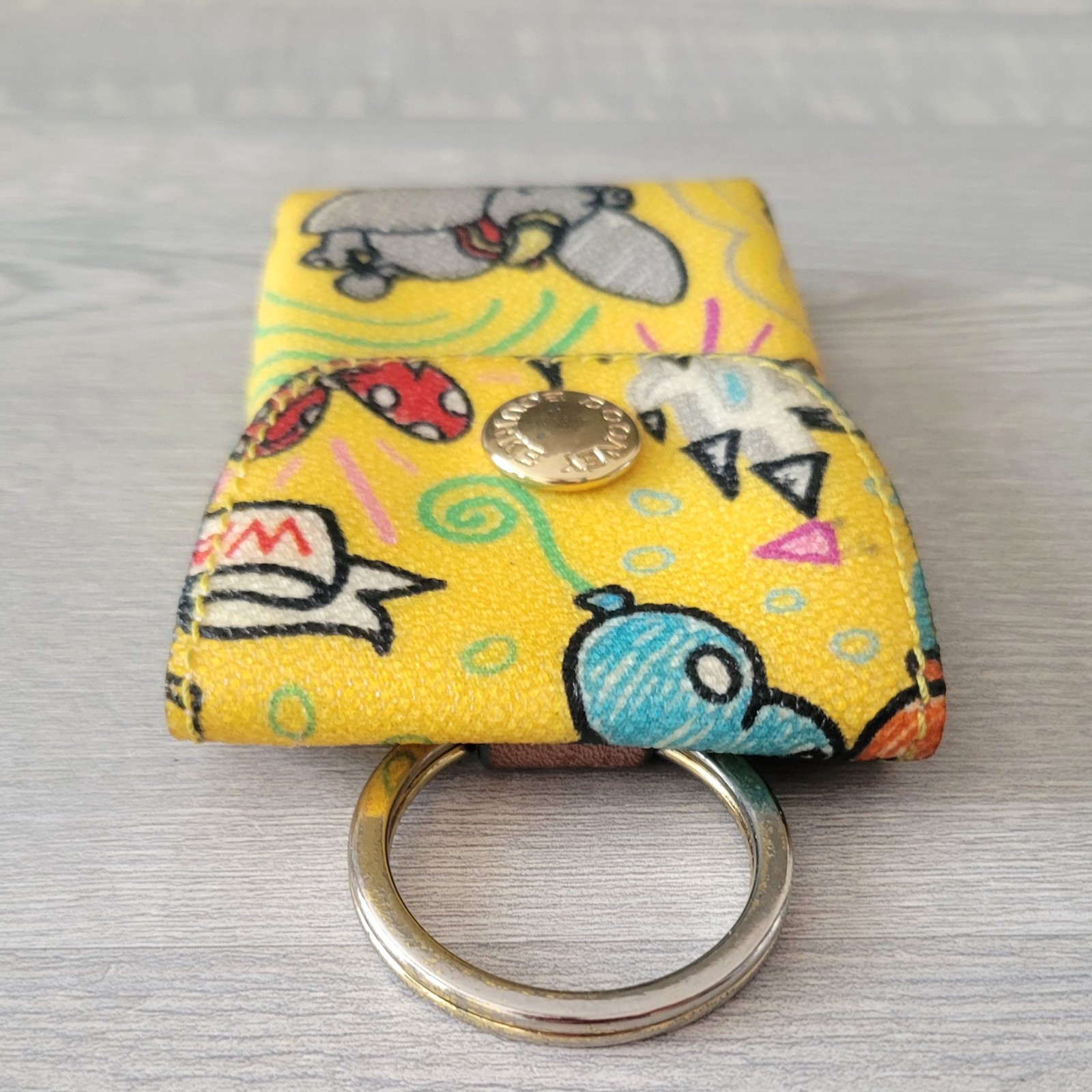 Dooney & Bourke Disney Parks Yellow Sketch Credit Card Key Fob Key Chain Ring