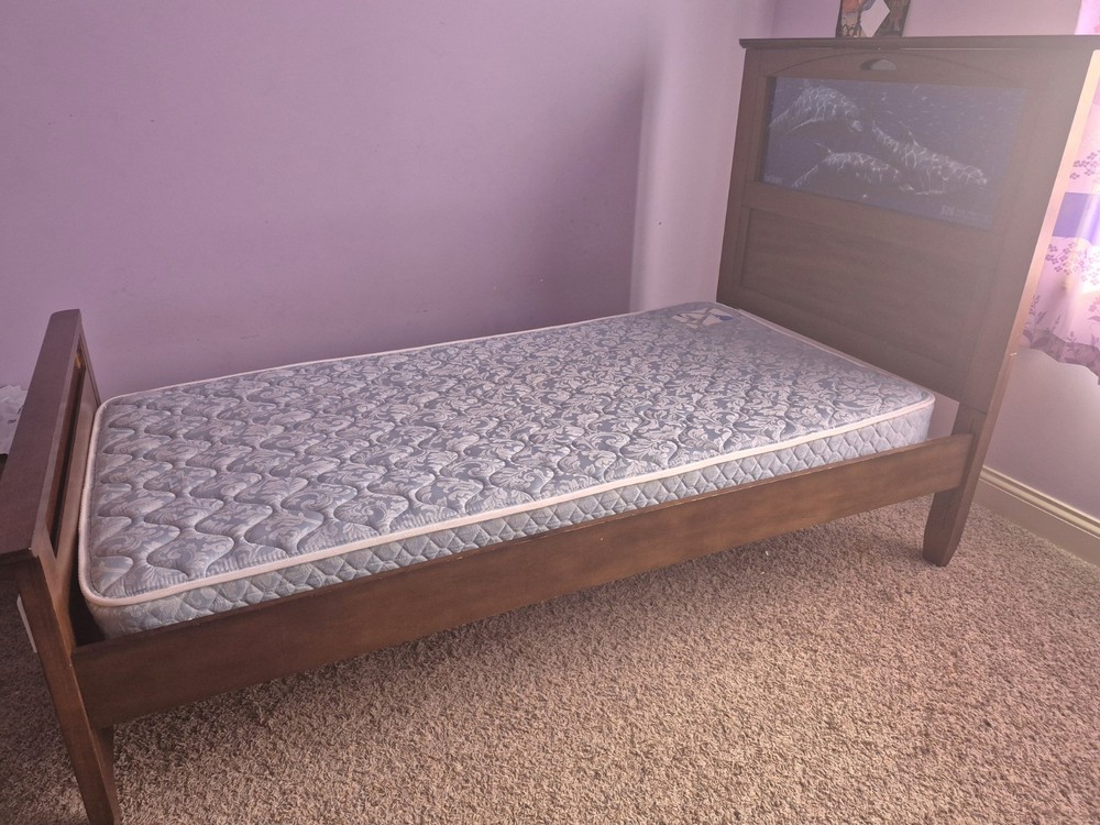 Wooden twin bed with remote controlled LED light