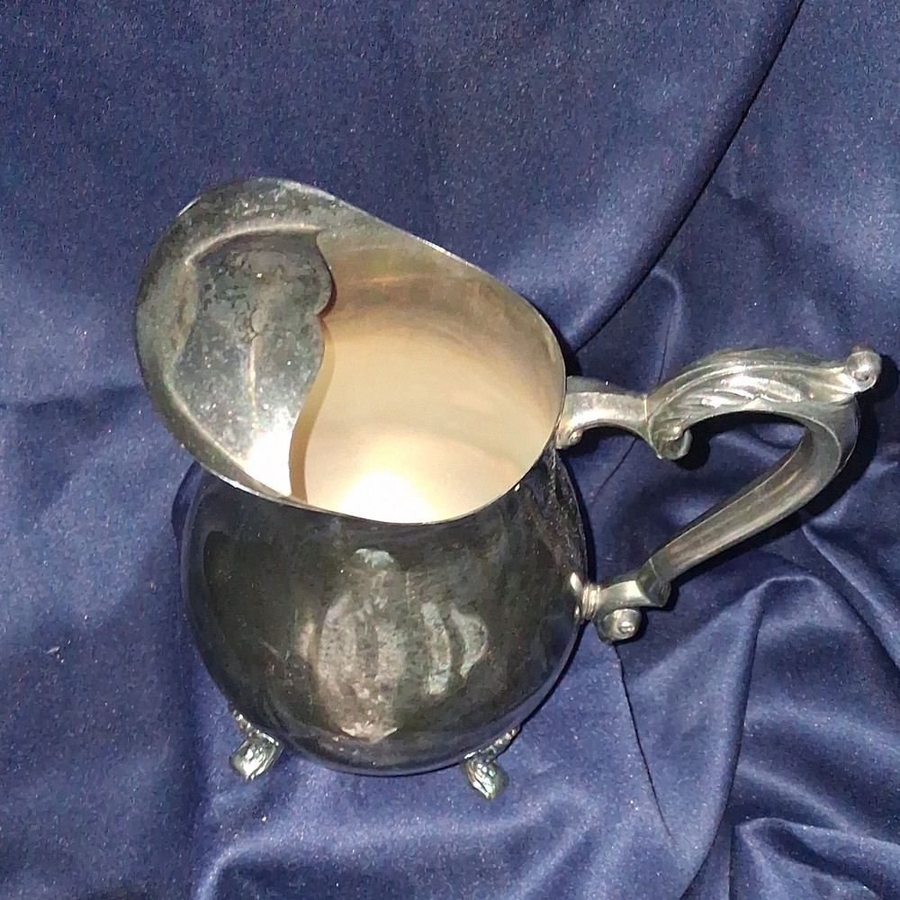 vintage Oneida silver-plated water pitcher.