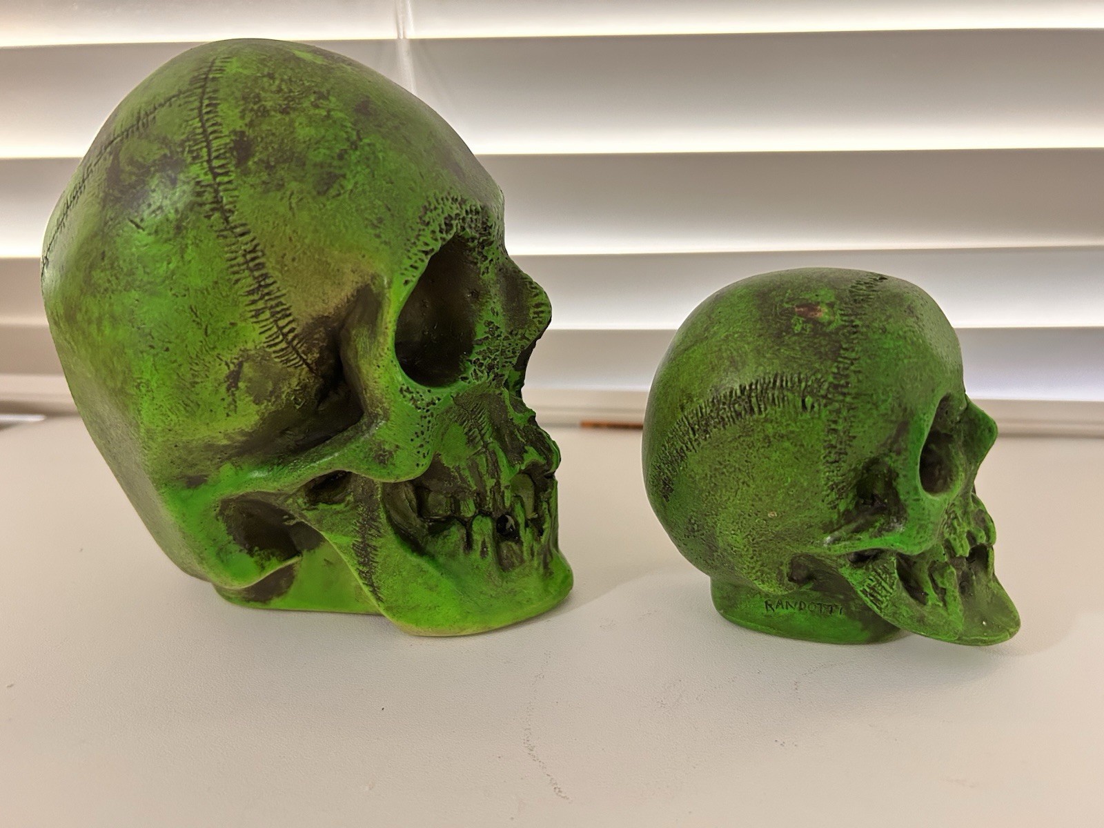 2 EA. RANDOTTI ORIGINAL FLUORESCENT GREEN LARGE & MEDIUM SKULLS STILL GLOW