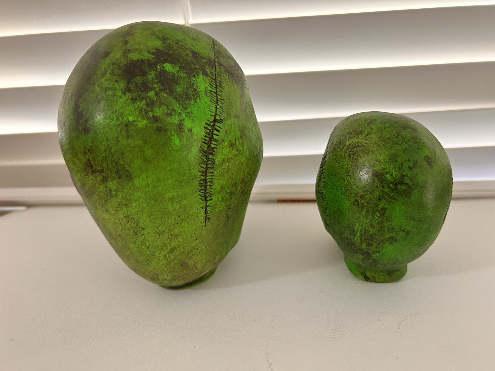 2 EA. RANDOTTI ORIGINAL FLUORESCENT GREEN LARGE & MEDIUM SKULLS STILL GLOW