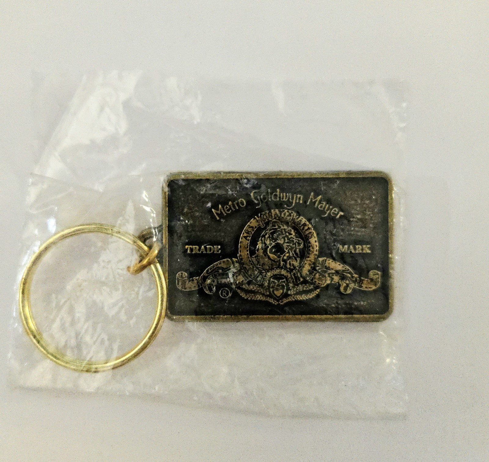 VINTAGE 1990's MGM LION LOGO PROMO METAL KEYCHAIN JAMES BOND 007 TANK GIRL MOVIE