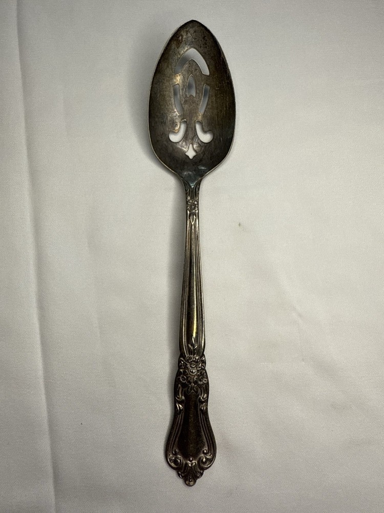 WM. A. Roger’s Oneida Silver Tone Serving Slotted Spoon Floral Cutout Handle