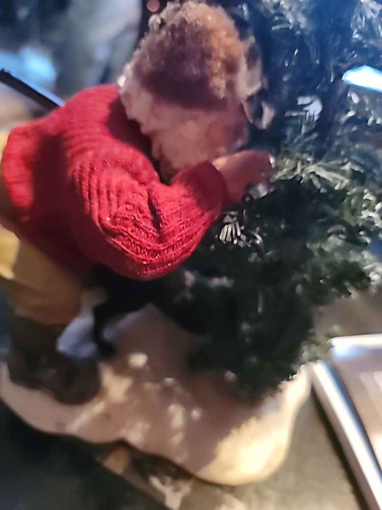 Santa Hiding By A TREE