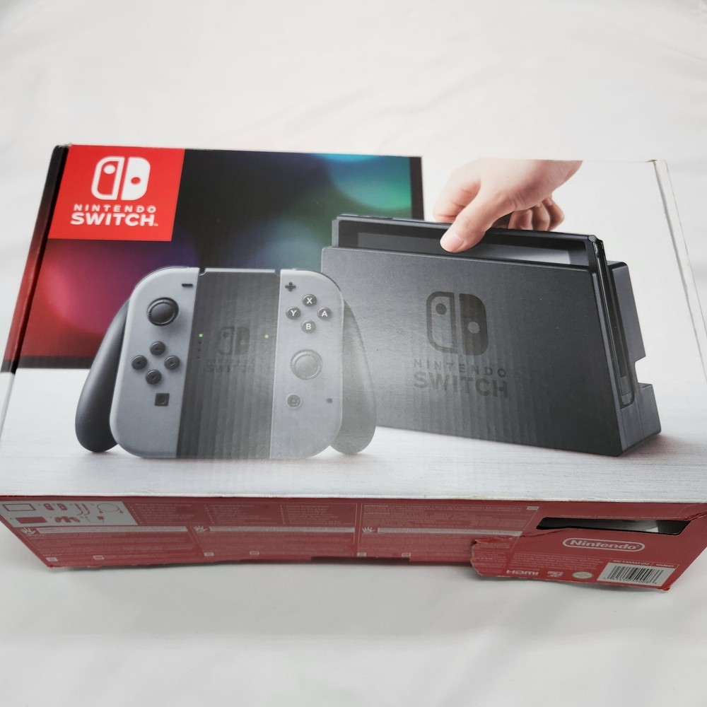 NINTENDO SWITCH MINT CONDITION INCLUDES JOYCONS WITH GRIP DOCK CHARGER HDMI