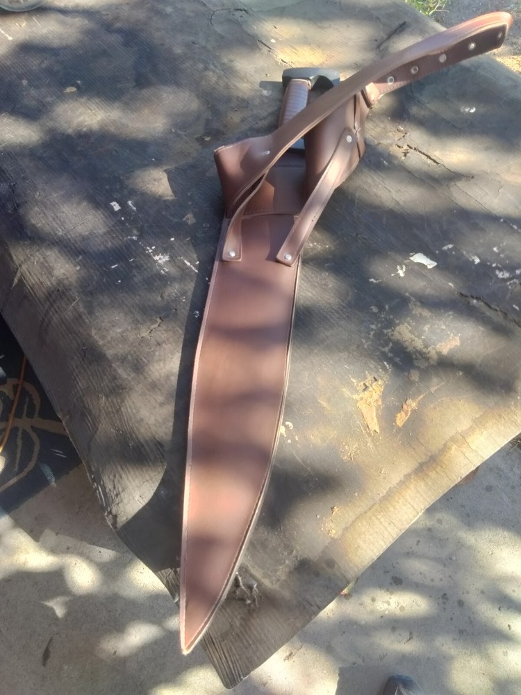 Unsharpened sword with carrying sheath and adjustable shoulder strap