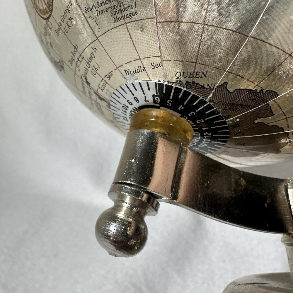 Small 9” Silver Globe Spins On Axis with Base