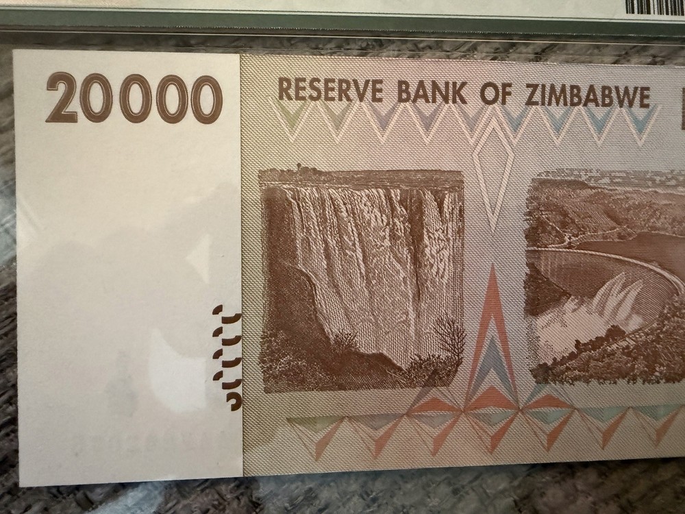 ✨ Zimbabwe 2008 20,000 Dollars — APMG Gem Uncirculated ✨