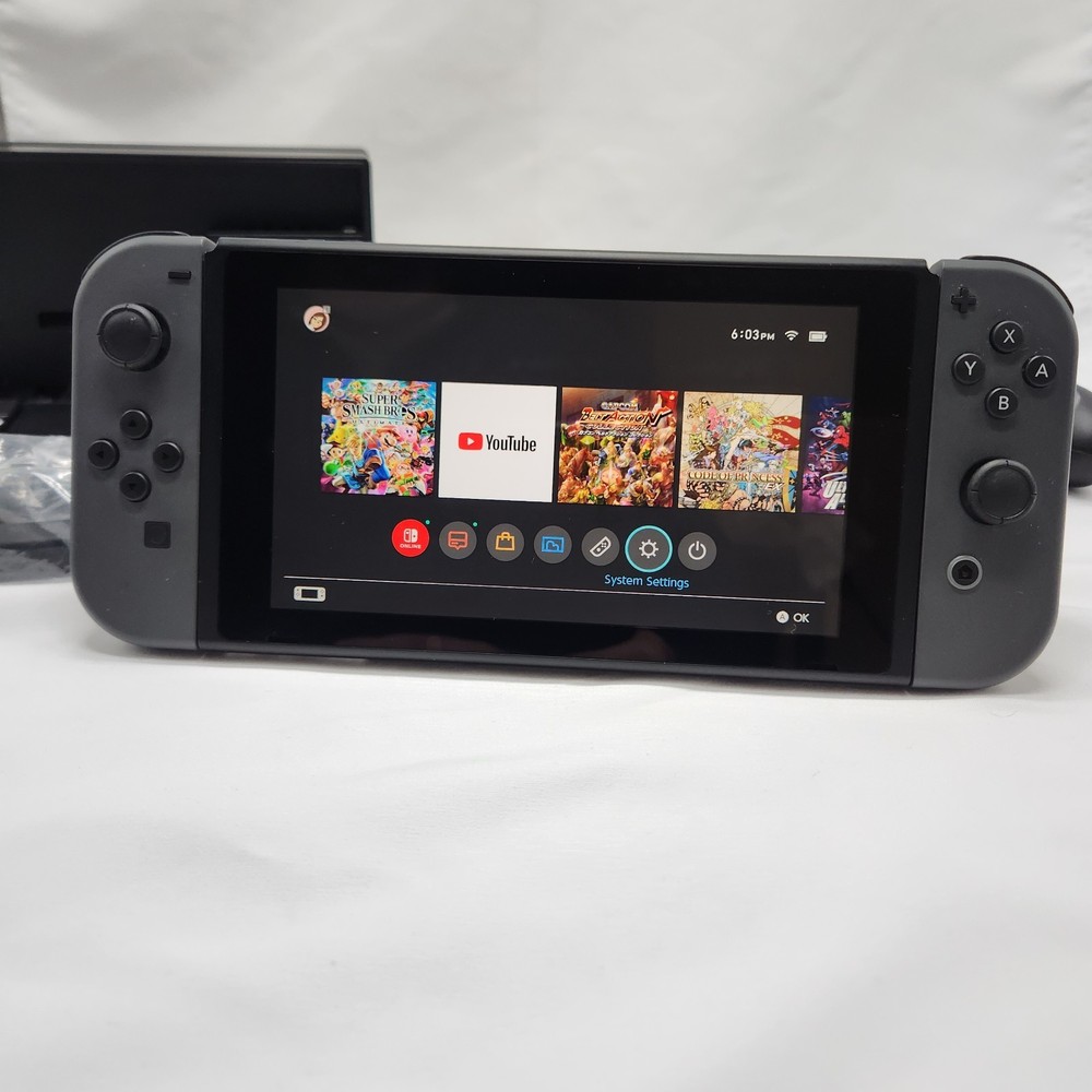 NINTENDO SWITCH MINT CONDITION INCLUDES JOYCONS WITH GRIP DOCK CHARGER HDMI