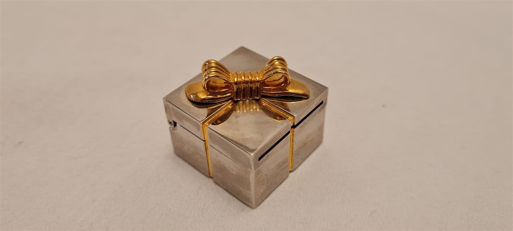 Gift mini clock with silver picture frame hidden inside gold trim