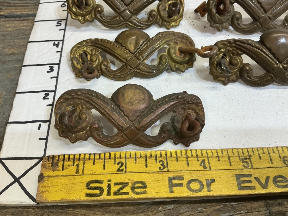 7 VINTAGE STAMPED BRASS DRAWER PULLS