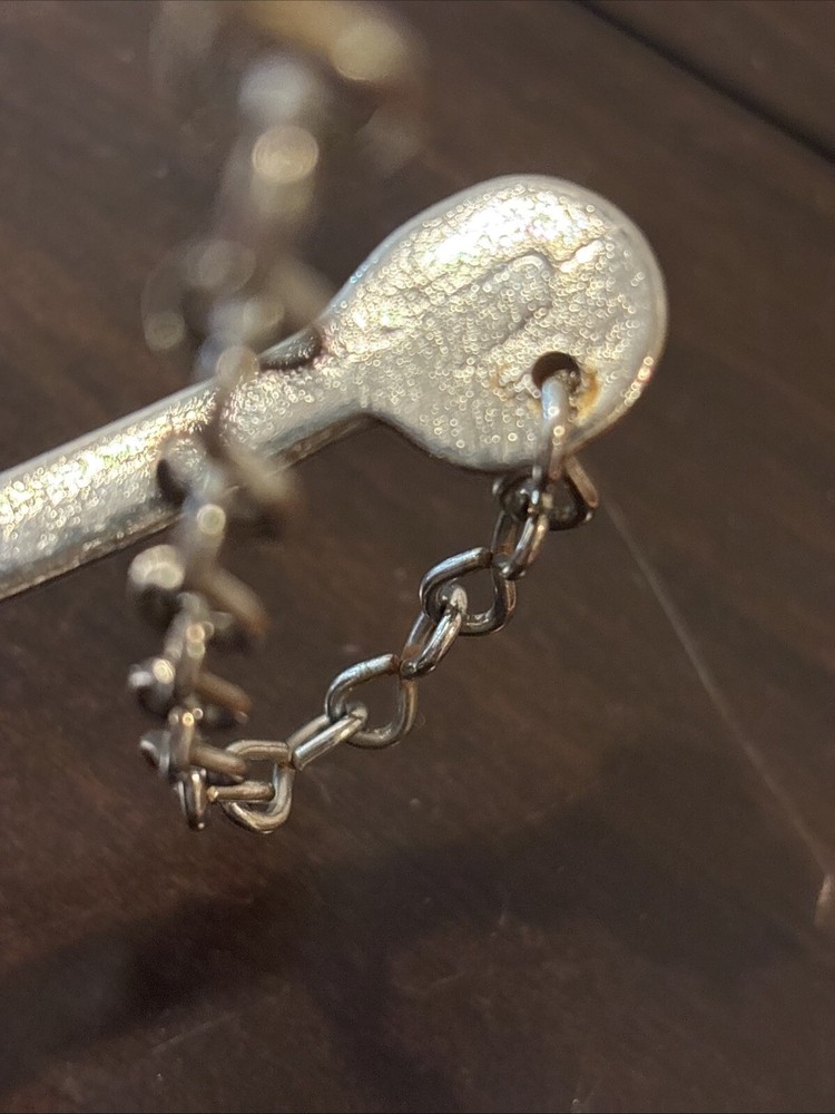 ONE UNMARKED SPUR - SILVER COLORED - SPINNING ROWEL