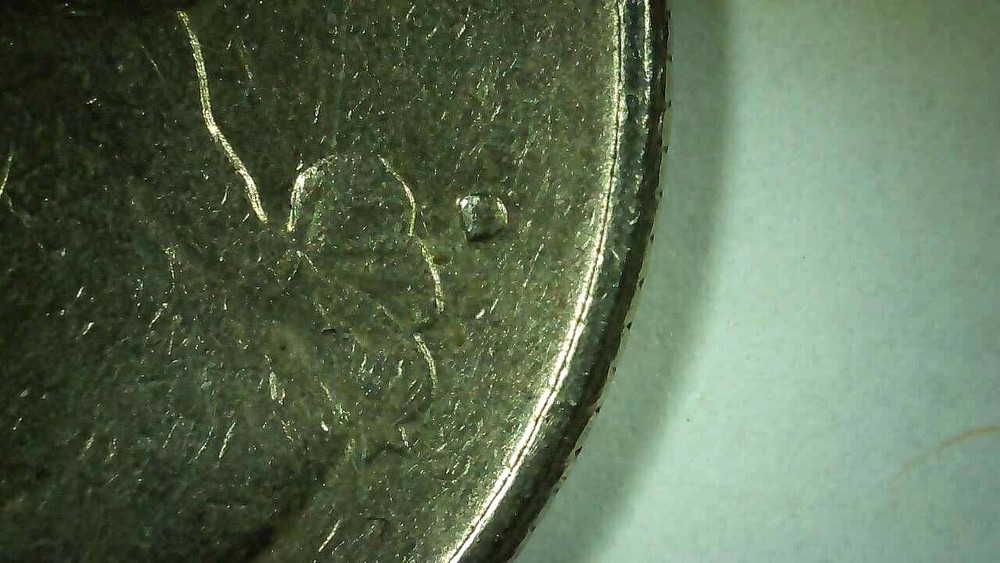 1977 Quarter filled D mint mark. Error tails side, UNI & AR Touching, See Pics