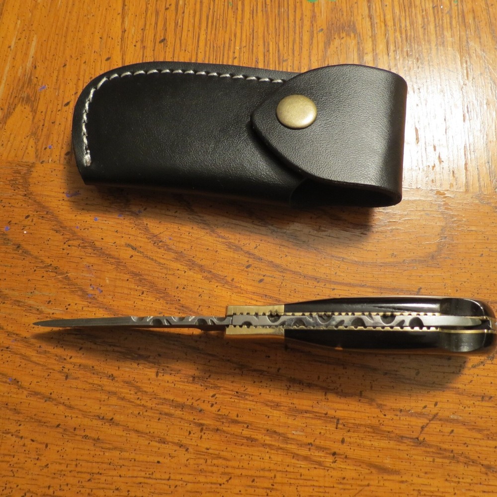 Damascus folding blade knife w/ black bone handle & leather sheath hand made