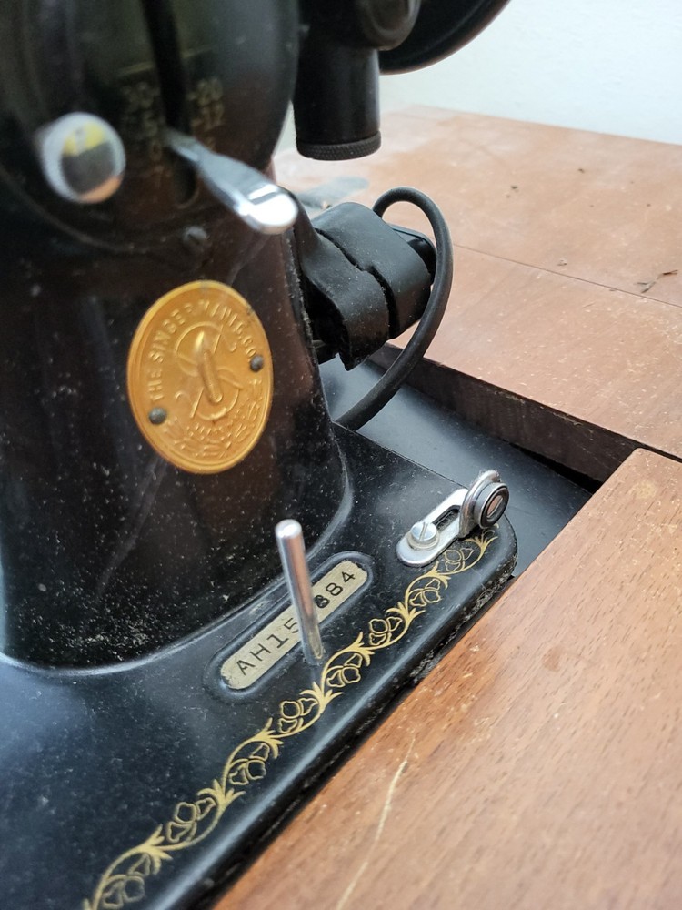 vintage SINGER sewing machine in cabinet