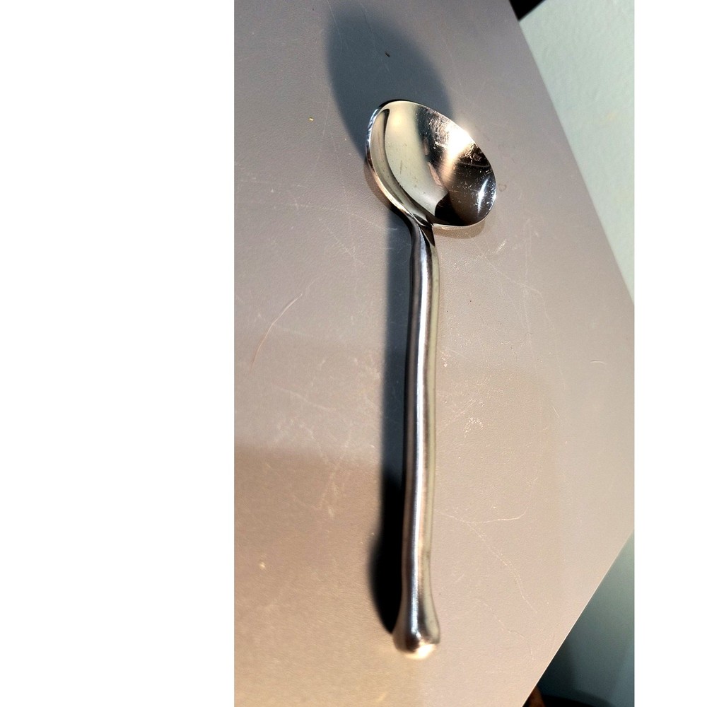 886. Exotic Platinum Stainless Steel Wavy Handled Spoon Flatware