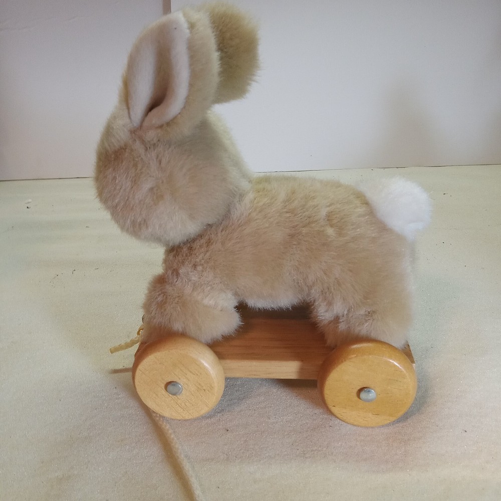 A bunny & duck on wheels pull toy