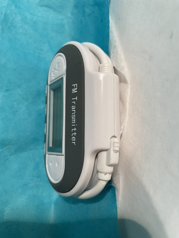 In Car FM Transmitter w Charger Model SP2202