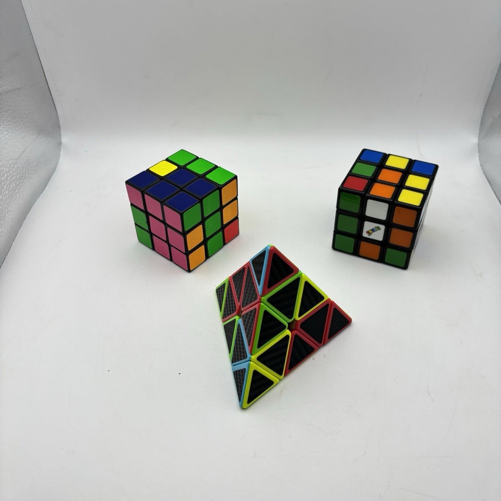 2 - Rubiks Cubes and 1 - Pyraminx Triangle Puzzle. VG Condition.