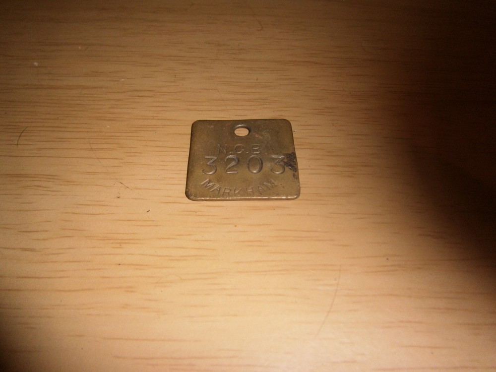 Mini brass plaque curio 3.2cm square. 'N.C.B. 3203 Markham' (E5b)