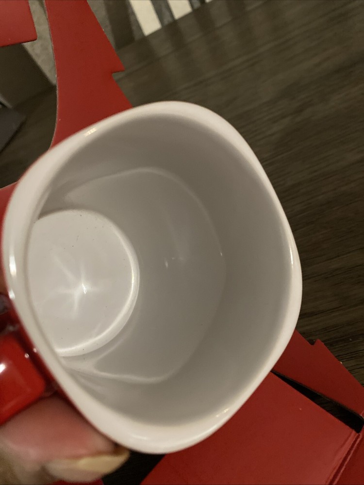 Mug Coffee & 3 packets Inside Dark Roast Nescafe Clasico.