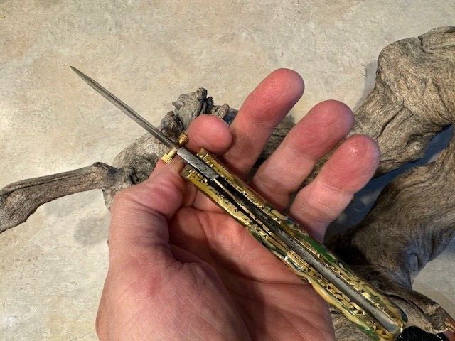 Sleek Damascus folding blade knife w/ ceramic handle, beautiful file work