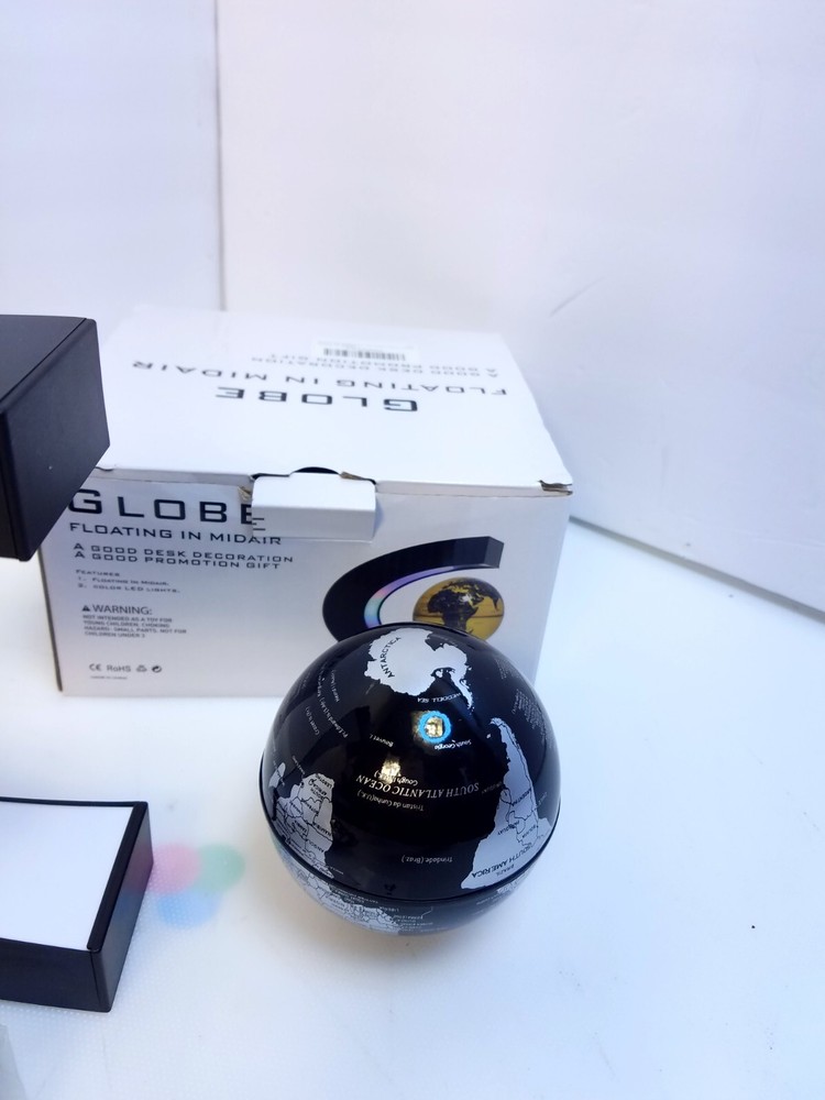 Globe Floating In Midair Black Globe Silver Map Light