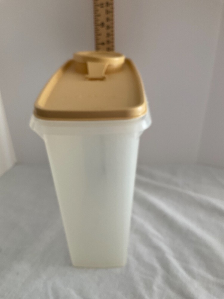 Tupperware container with beige pour lid 8” x7”