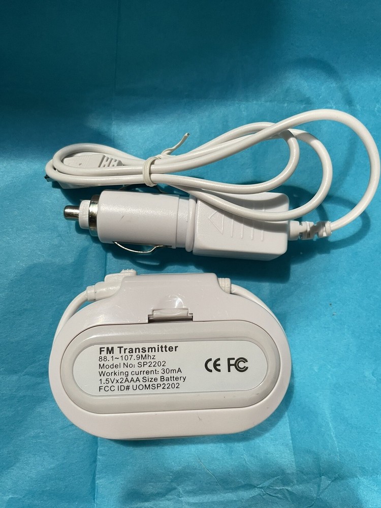 In Car FM Transmitter w Charger Model SP2202