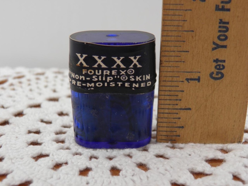 VINTAGE FOUR X CONDOMS IN TINY PLASTIC CAN