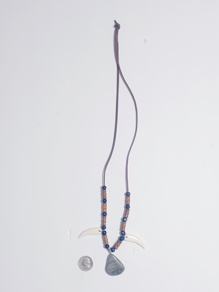 River Rock , Faux Wolf Teeth Beaded necklace .