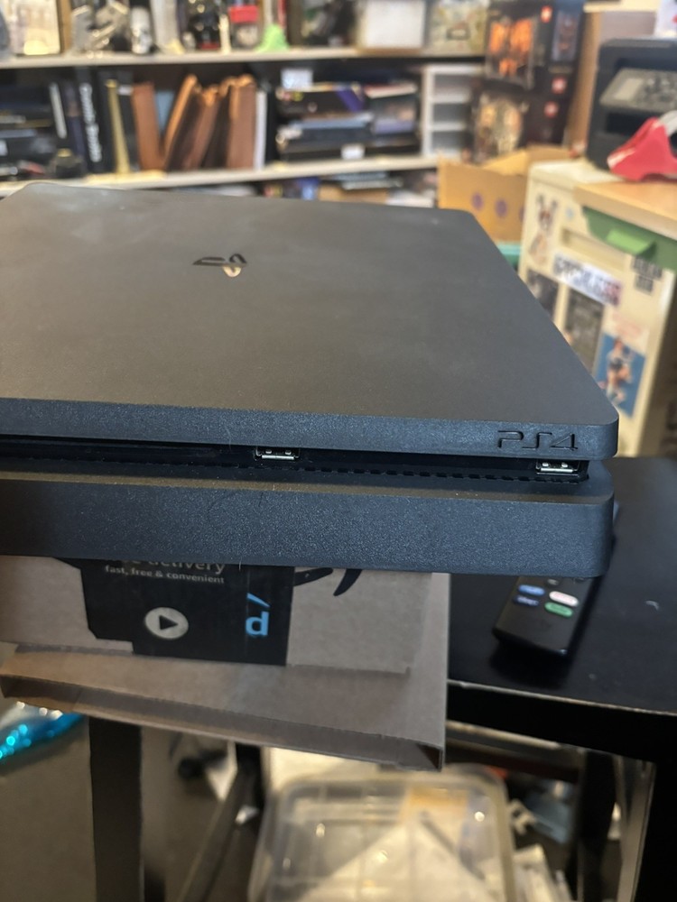 Playstation 4 Console with controller and seven games
