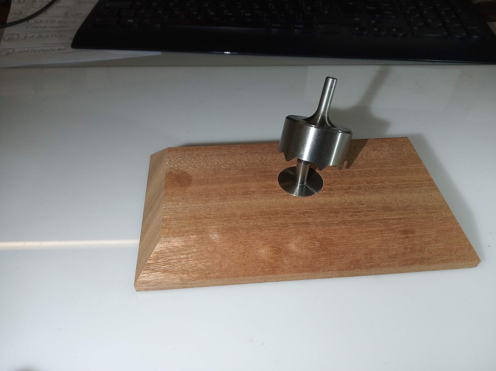 Dinker for jukebox records --cuts clean accurate holes easily.