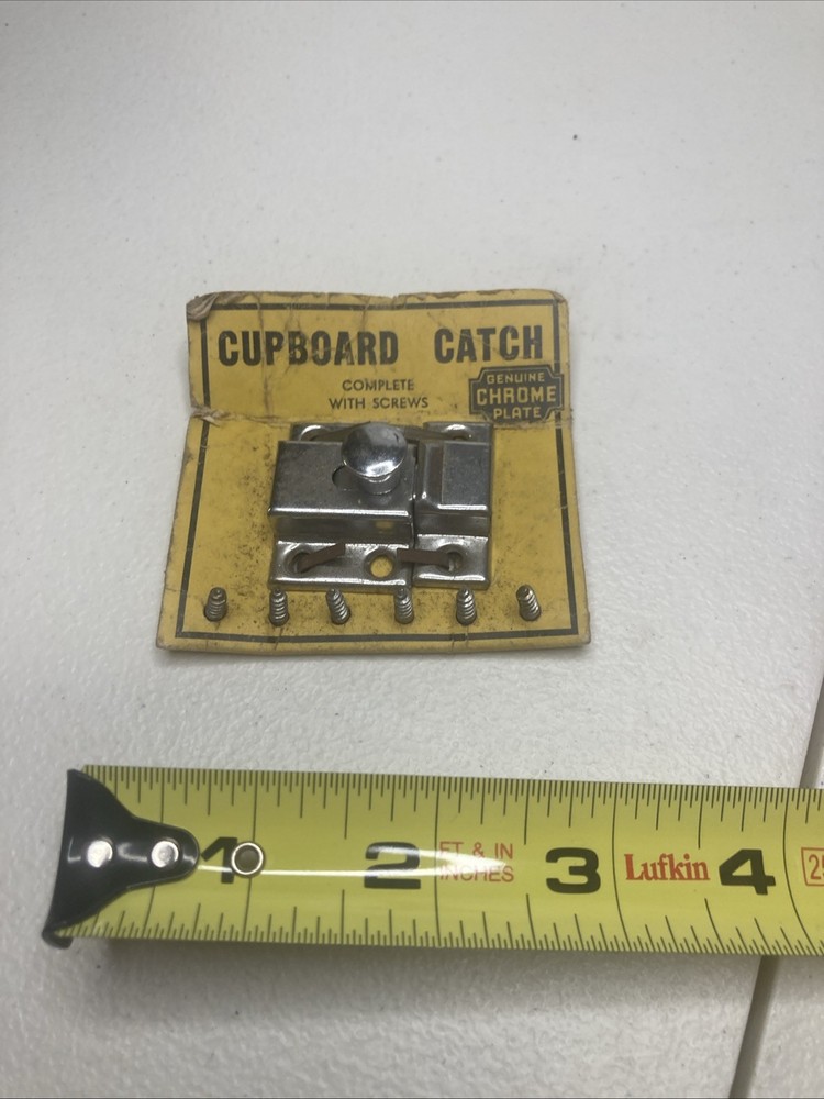 NOS- vintage chrome-plated cupboard catch.