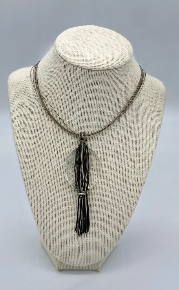 Clear large glass stone with multi layered chain silver tassel