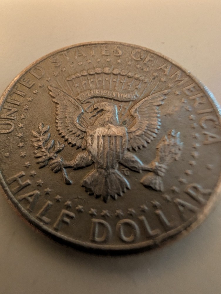 1971 Half Dollar Struck Through Wire And Error On His Cheek